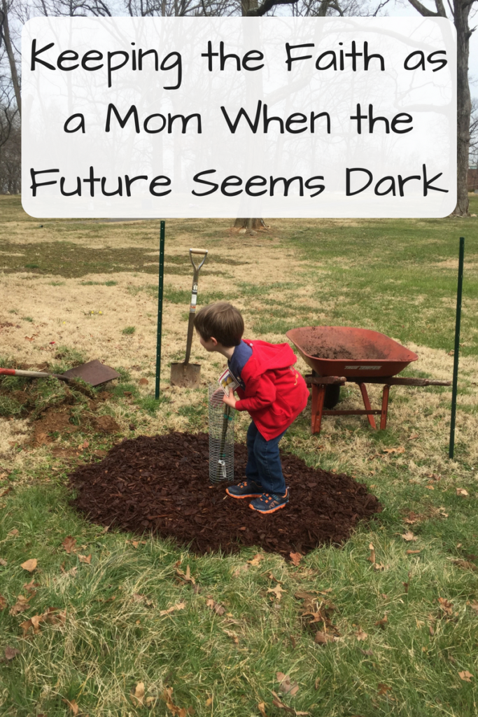 Keeping the Faith as a Mom When the Future Seems Dark (Photo: Young white boy hugging a small tree in a yard)