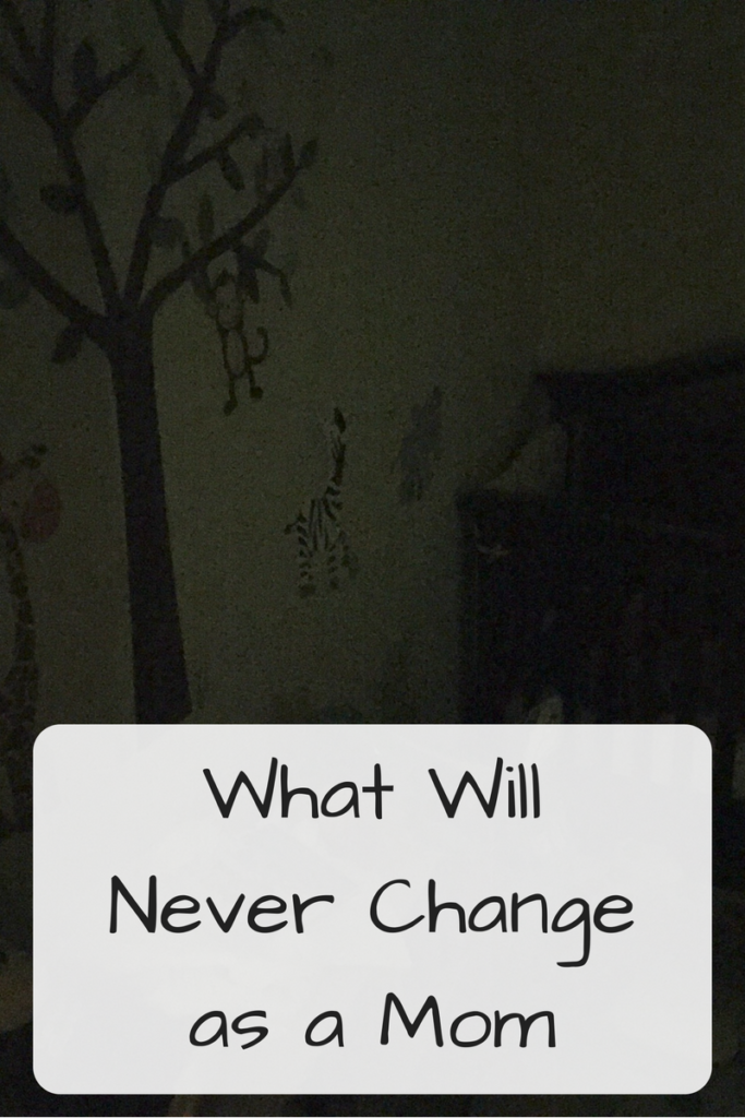 What Will Never Change as a Mom (Photo: Dark room with animal decorations and crib)