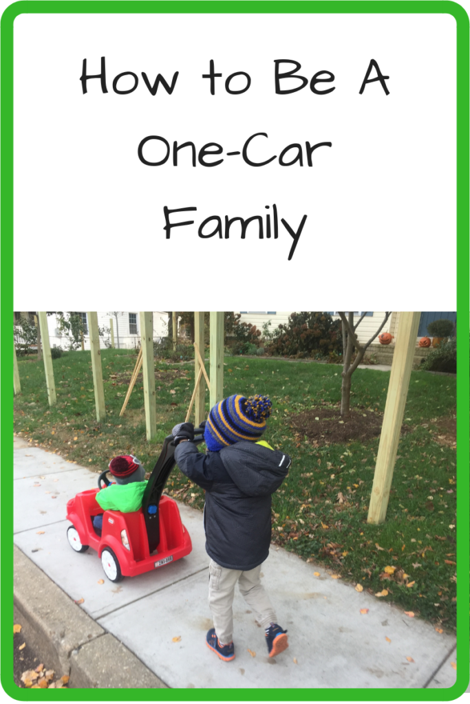 How to Be A One-Car Family (Photo: One child pushing another down the sidewalk in a toy car)