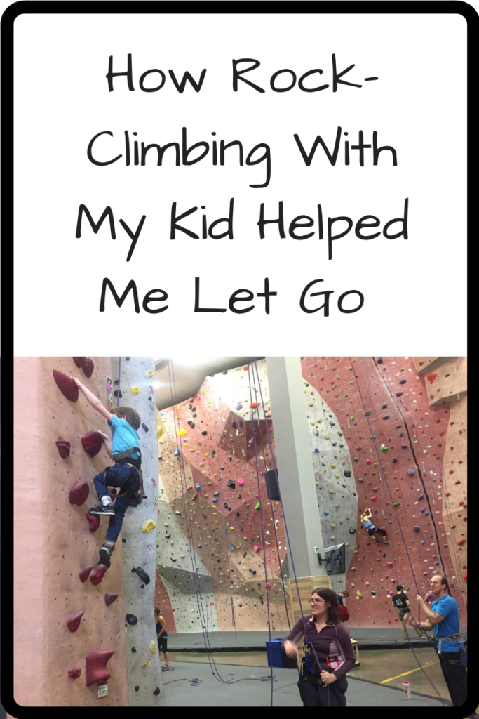 Photo: A woman belaying a child who is climbing up an indoor climbing wall. (Text: How Rock-Climbing With My Son Helped Me Let Go)