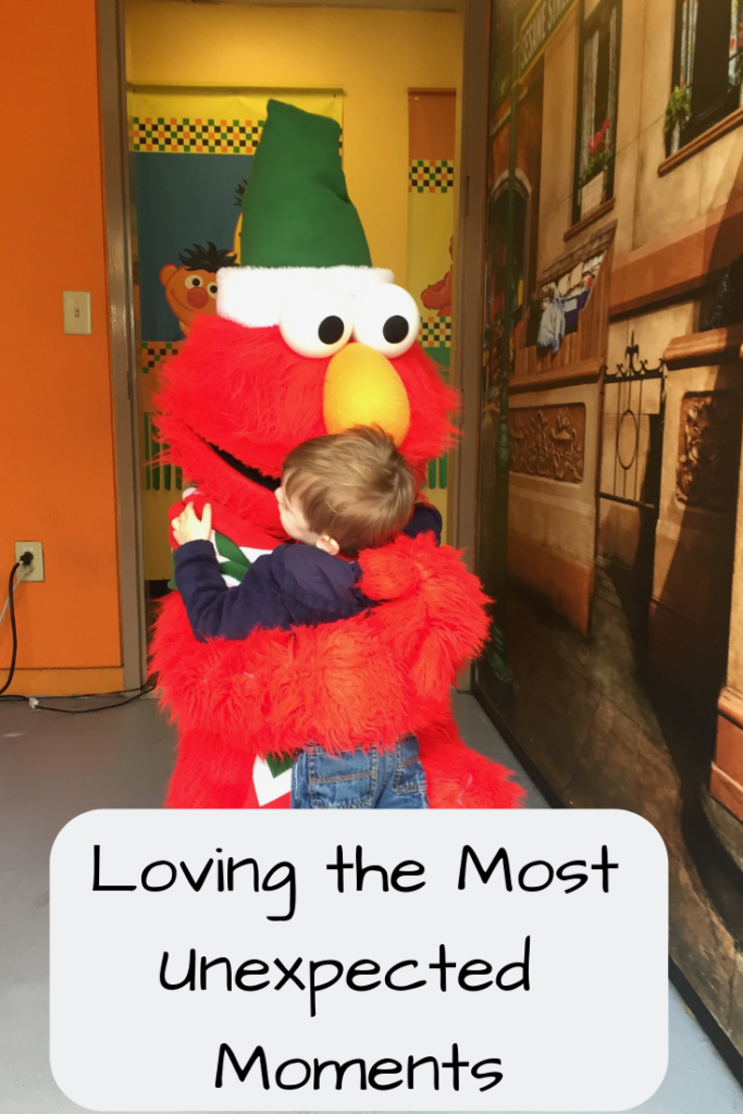 Text: Loving the Most Unexpected Moments (Photo: Little boy hugging Elmo)