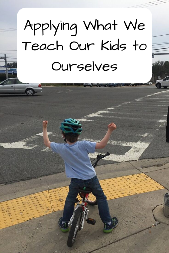 Text: Applying What We Teach Our Kids to Ourselves Photo: White child on a bike holding up his arms at an intersection