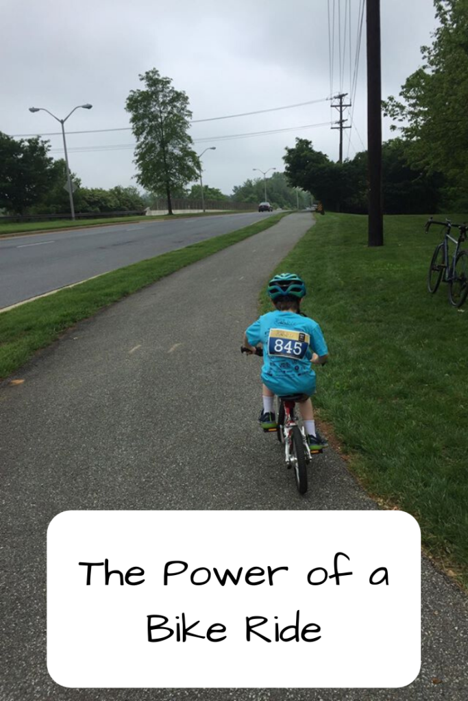 Photo: Boy riding a bike up a paved path; Text: The Power of a Bike Ride
