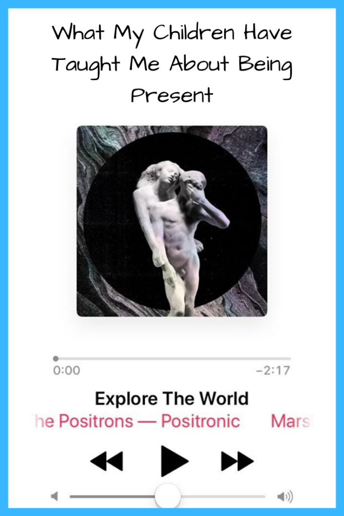Photo: Album cover with white statue on it with Explore the World; Text: What My Children Have Taught Me About Being Present