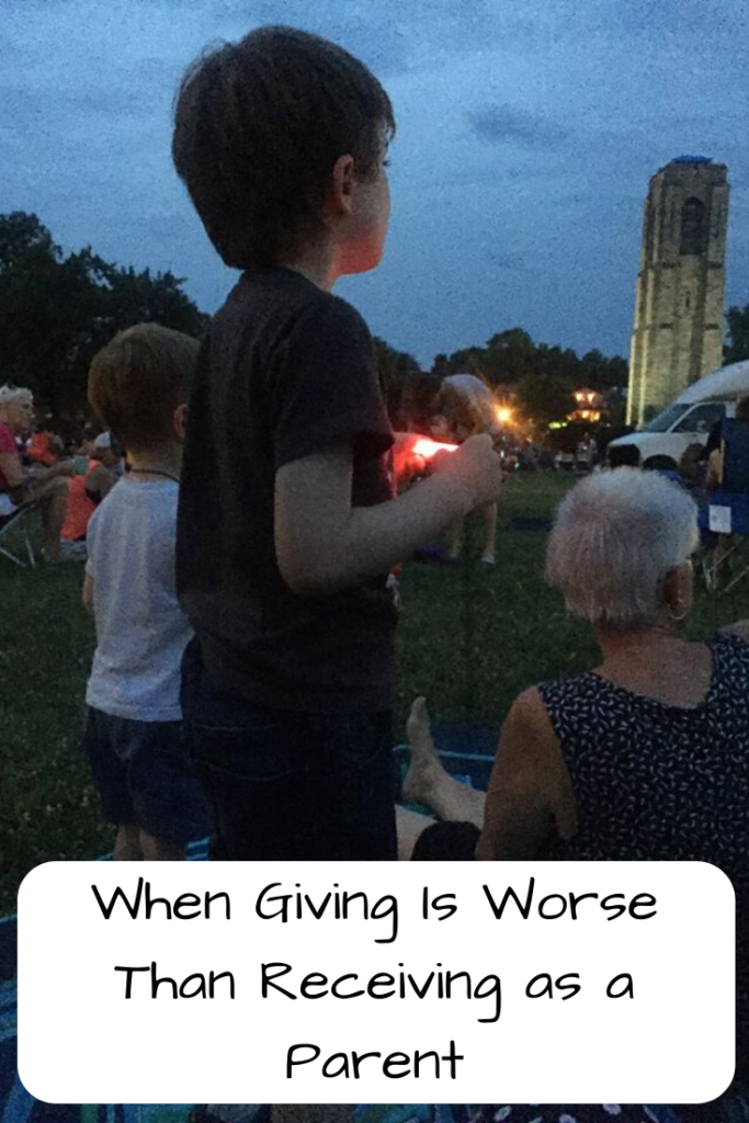 Photo: White child standing in the evening with a white woman sitting in front of him; Text: When Giving is Worse than Receiving as a Parent