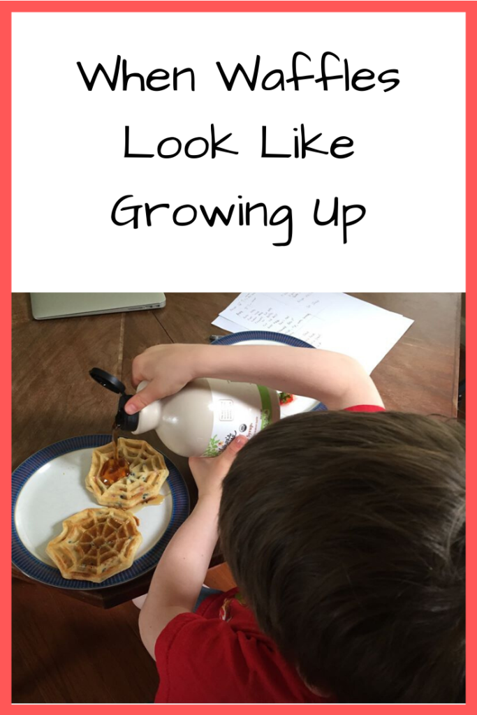 Photo: White boy pouring syrup on two Spiderman waffles at a table; Text: When Waffles Look Like Growing Up