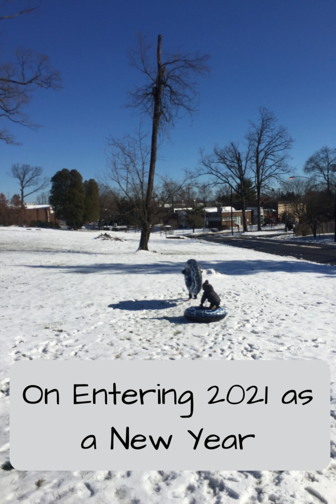 Photo: Two kids sledding down a small hill in the snow Text: On Entering 2021 as a New Year