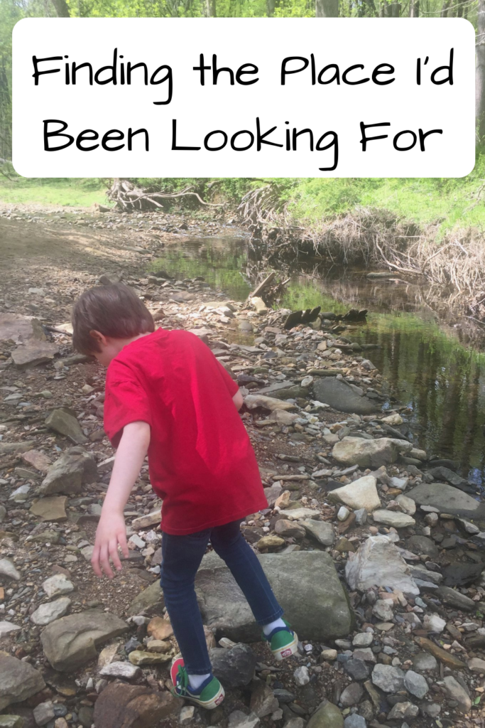 Finding the Place I'd Been Looking For (photo of a young boy walking on rocks through a stream)