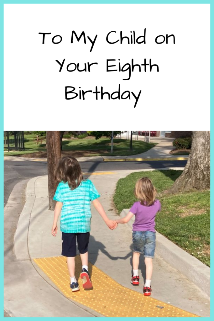 Text: To My Child on Your Eighth Birthday; Photo of two white boys wearing shorts and t-shirts walking down a sidewalk
