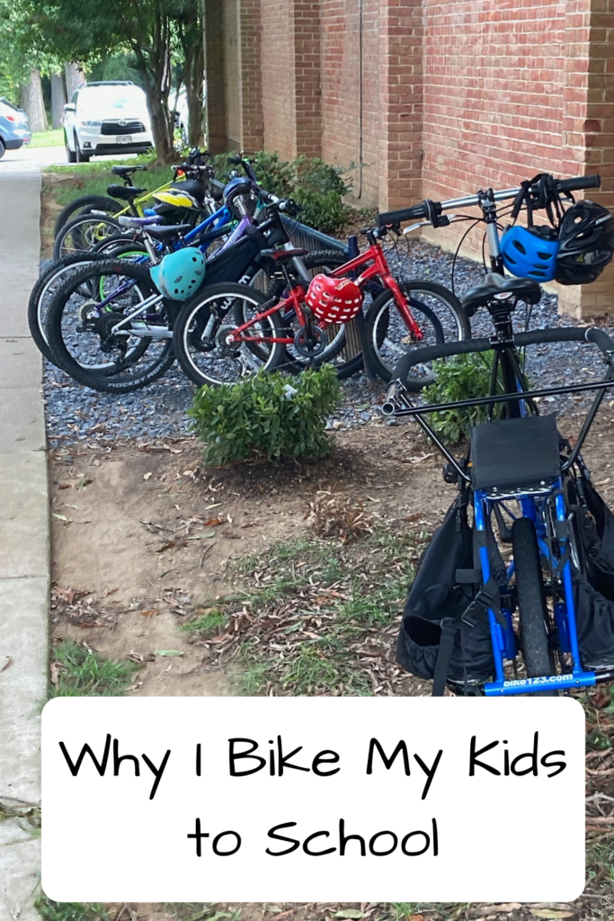 Photo of a bunch of bikes on a bike rack with a cargo bike in front of it; text: Why I Bike My Kids to School