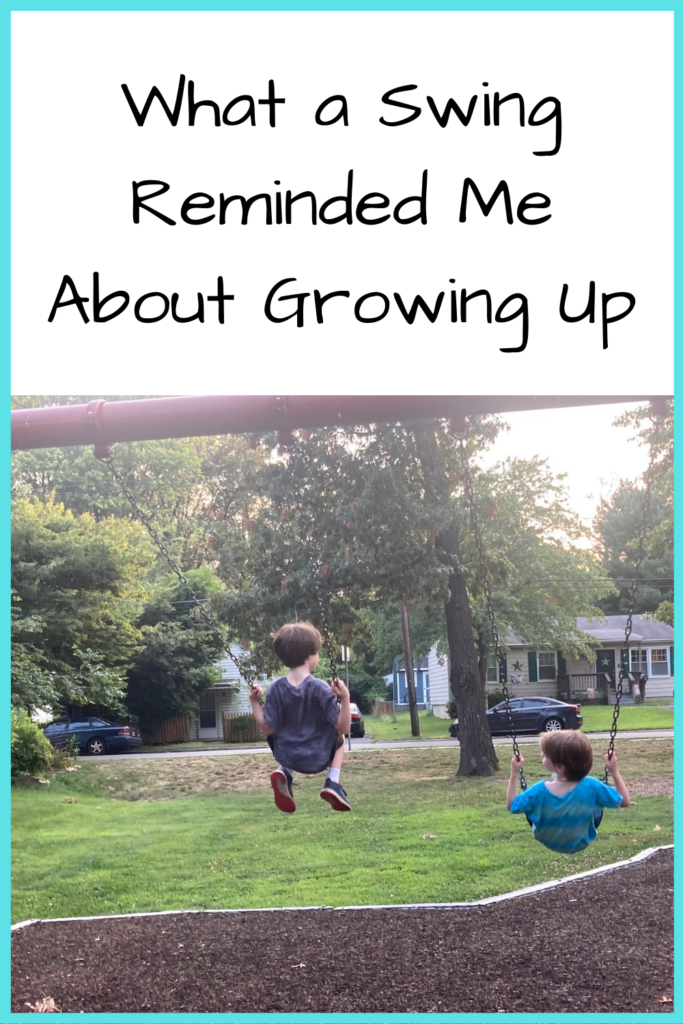 Text: What a Swing Reminded Me About Growing Up; Photo: Two white boys swinging on a swing set at a park, with trees and grass in front of them